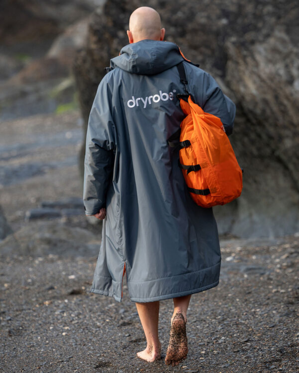 male in grey and orange advance dryrobe behind